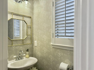 Inviting 3-bedroom, 2.5-bath home on a beautifully landscaped on Charleston National Golf Club in South Carolina - for sale on GolfHomes.com, golf home, golf lot