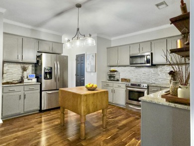 Inviting 3-bedroom, 2.5-bath home on a beautifully landscaped on Charleston National Golf Club in South Carolina - for sale on GolfHomes.com, golf home, golf lot