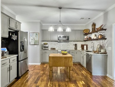 Inviting 3-bedroom, 2.5-bath home on a beautifully landscaped on Charleston National Golf Club in South Carolina - for sale on GolfHomes.com, golf home, golf lot