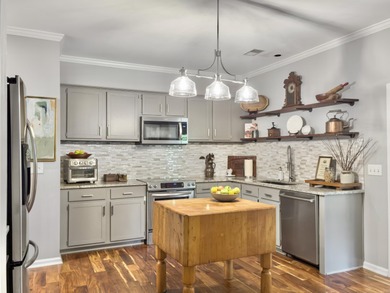 Inviting 3-bedroom, 2.5-bath home on a beautifully landscaped on Charleston National Golf Club in South Carolina - for sale on GolfHomes.com, golf home, golf lot