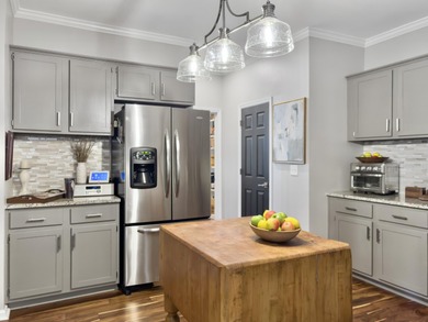 Inviting 3-bedroom, 2.5-bath home on a beautifully landscaped on Charleston National Golf Club in South Carolina - for sale on GolfHomes.com, golf home, golf lot