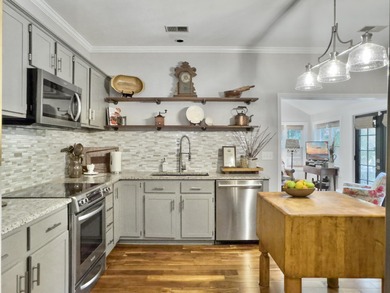 Inviting 3-bedroom, 2.5-bath home on a beautifully landscaped on Charleston National Golf Club in South Carolina - for sale on GolfHomes.com, golf home, golf lot