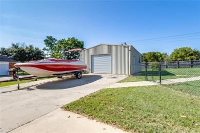 Stunning home, remodeled in 2023, situated on a .684 acre lot on Lake Kiowa Golf Course in Texas - for sale on GolfHomes.com, golf home, golf lot