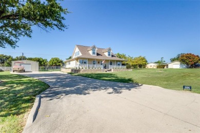 Stunning home, remodeled in 2023, situated on a .684 acre lot on Lake Kiowa Golf Course in Texas - for sale on GolfHomes.com, golf home, golf lot