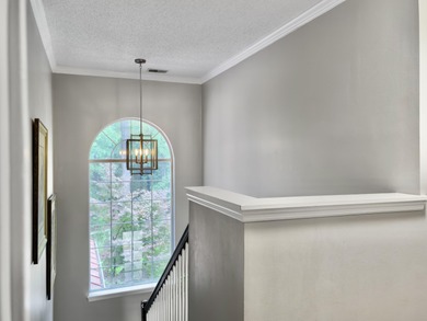 Inviting 3-bedroom, 2.5-bath home on a beautifully landscaped on Charleston National Golf Club in South Carolina - for sale on GolfHomes.com, golf home, golf lot