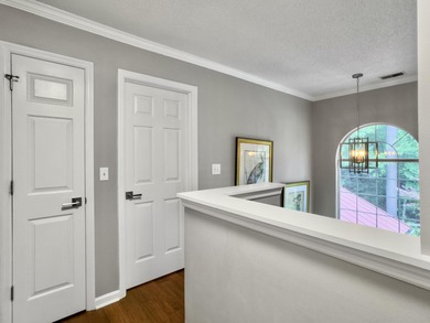 Inviting 3-bedroom, 2.5-bath home on a beautifully landscaped on Charleston National Golf Club in South Carolina - for sale on GolfHomes.com, golf home, golf lot