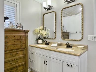 Inviting 3-bedroom, 2.5-bath home on a beautifully landscaped on Charleston National Golf Club in South Carolina - for sale on GolfHomes.com, golf home, golf lot