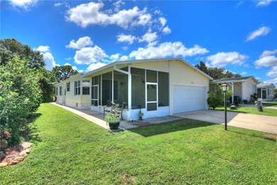 Live the Barefoot Bay lifestyle in this beautifully landscaped on Barefoot Bay Golf Course in Florida - for sale on GolfHomes.com, golf home, golf lot