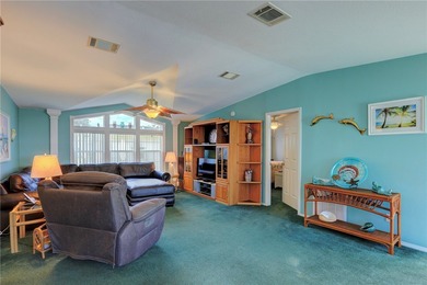 Live the Barefoot Bay lifestyle in this beautifully landscaped on Barefoot Bay Golf Course in Florida - for sale on GolfHomes.com, golf home, golf lot
