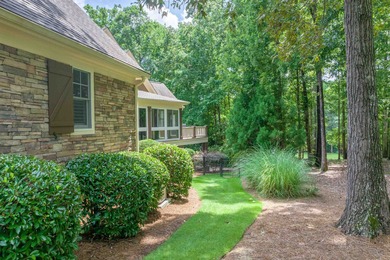 This stunning 4-bedroom, 4-bath home offers a refined living on Reynolds Lake Oconee - The Oconee in Georgia - for sale on GolfHomes.com, golf home, golf lot