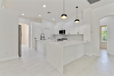 Welcome to 13792 Long Lake, a fully remodeled luxury residence on Riverwood Golf Club in Florida - for sale on GolfHomes.com, golf home, golf lot