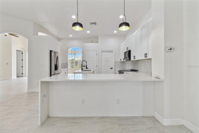 Welcome to 13792 Long Lake, a fully remodeled luxury residence on Riverwood Golf Club in Florida - for sale on GolfHomes.com, golf home, golf lot