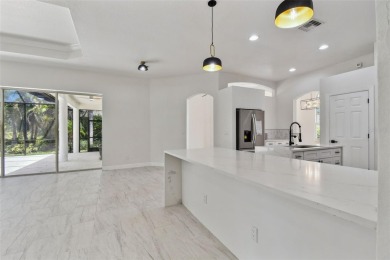 Welcome to 13792 Long Lake, a fully remodeled luxury residence on Riverwood Golf Club in Florida - for sale on GolfHomes.com, golf home, golf lot