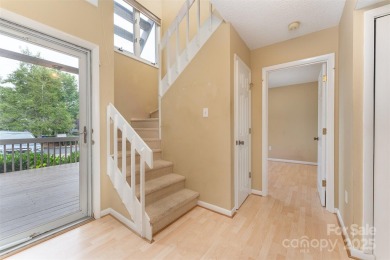 You must see this light-filled, two-story end unit condo at The on Black Mountain Golf Course in North Carolina - for sale on GolfHomes.com, golf home, golf lot