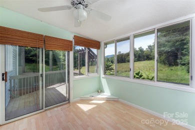 You must see this light-filled, two-story end unit condo at The on Black Mountain Golf Course in North Carolina - for sale on GolfHomes.com, golf home, golf lot