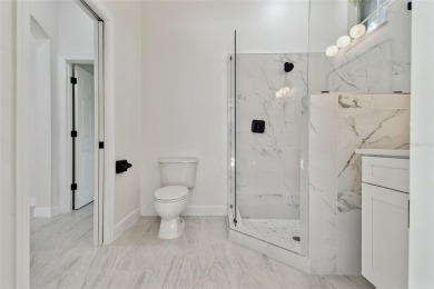 Welcome to 13792 Long Lake, a fully remodeled luxury residence on Riverwood Golf Club in Florida - for sale on GolfHomes.com, golf home, golf lot