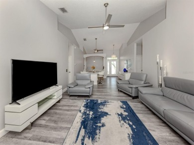 A charming three-bedroom, two-bath, desirable two-car side entry on The River Club in Florida - for sale on GolfHomes.com, golf home, golf lot