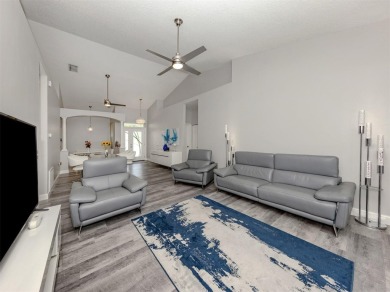 A charming three-bedroom, two-bath, desirable two-car side entry on The River Club in Florida - for sale on GolfHomes.com, golf home, golf lot