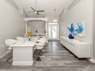 A charming three-bedroom, two-bath, desirable two-car side entry on The River Club in Florida - for sale on GolfHomes.com, golf home, golf lot