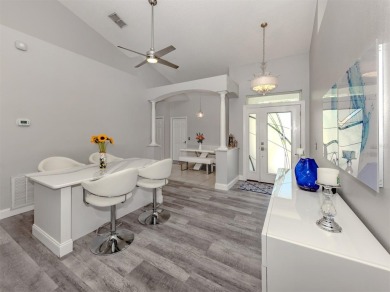 A charming three-bedroom, two-bath, desirable two-car side entry on The River Club in Florida - for sale on GolfHomes.com, golf home, golf lot
