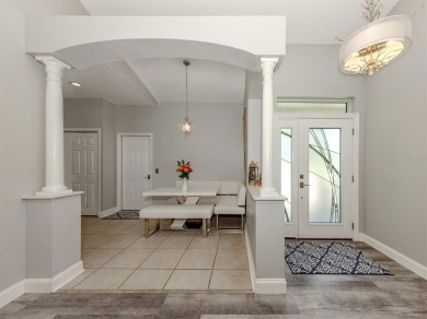 A charming three-bedroom, two-bath, desirable two-car side entry on The River Club in Florida - for sale on GolfHomes.com, golf home, golf lot