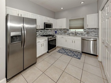A charming three-bedroom, two-bath, desirable two-car side entry on The River Club in Florida - for sale on GolfHomes.com, golf home, golf lot