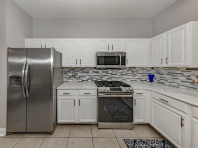 A charming three-bedroom, two-bath, desirable two-car side entry on The River Club in Florida - for sale on GolfHomes.com, golf home, golf lot