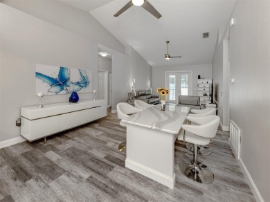 A charming three-bedroom, two-bath, desirable two-car side entry on The River Club in Florida - for sale on GolfHomes.com, golf home, golf lot