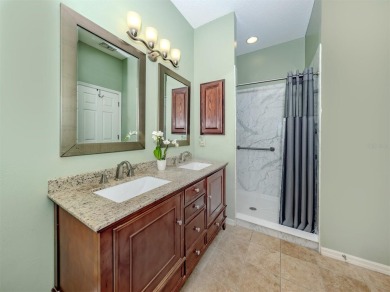 A charming three-bedroom, two-bath, desirable two-car side entry on The River Club in Florida - for sale on GolfHomes.com, golf home, golf lot