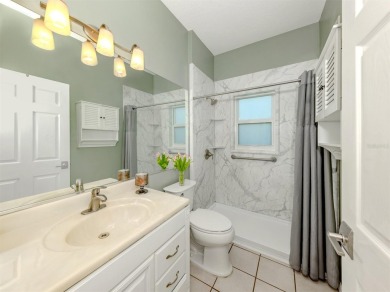 A charming three-bedroom, two-bath, desirable two-car side entry on The River Club in Florida - for sale on GolfHomes.com, golf home, golf lot