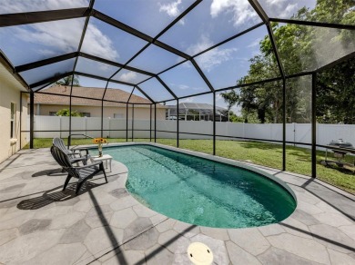 A charming three-bedroom, two-bath, desirable two-car side entry on The River Club in Florida - for sale on GolfHomes.com, golf home, golf lot