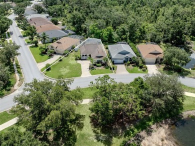 A charming three-bedroom, two-bath, desirable two-car side entry on The River Club in Florida - for sale on GolfHomes.com, golf home, golf lot