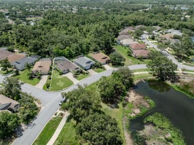 A charming three-bedroom, two-bath, desirable two-car side entry on The River Club in Florida - for sale on GolfHomes.com, golf home, golf lot
