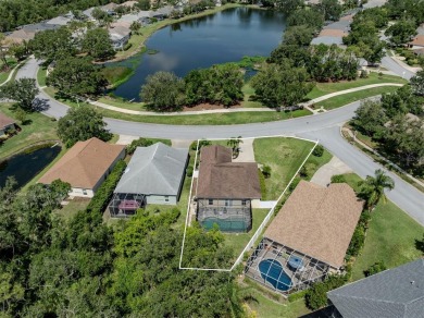 A charming three-bedroom, two-bath, desirable two-car side entry on The River Club in Florida - for sale on GolfHomes.com, golf home, golf lot