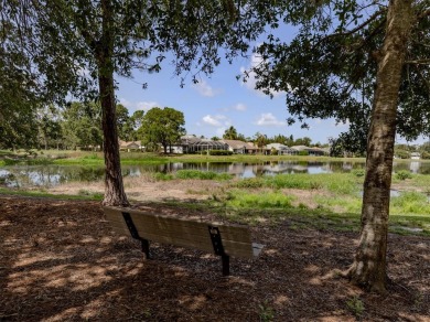 A charming three-bedroom, two-bath, desirable two-car side entry on The River Club in Florida - for sale on GolfHomes.com, golf home, golf lot