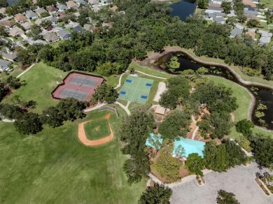 A charming three-bedroom, two-bath, desirable two-car side entry on The River Club in Florida - for sale on GolfHomes.com, golf home, golf lot