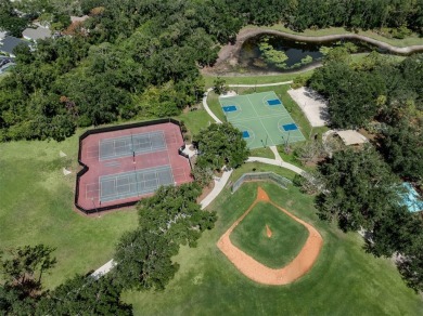A charming three-bedroom, two-bath, desirable two-car side entry on The River Club in Florida - for sale on GolfHomes.com, golf home, golf lot