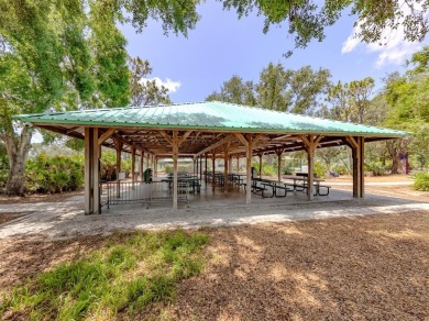 A charming three-bedroom, two-bath, desirable two-car side entry on The River Club in Florida - for sale on GolfHomes.com, golf home, golf lot