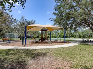 A charming three-bedroom, two-bath, desirable two-car side entry on The River Club in Florida - for sale on GolfHomes.com, golf home, golf lot
