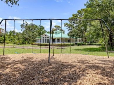 A charming three-bedroom, two-bath, desirable two-car side entry on The River Club in Florida - for sale on GolfHomes.com, golf home, golf lot
