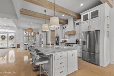 Welcome to 121 Camden Lane - a dreamy waterfront retreat!  This on Lake Caroline Golf Club in Mississippi - for sale on GolfHomes.com, golf home, golf lot