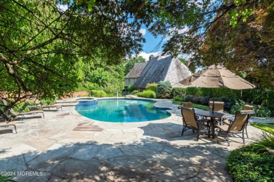 This stunning 5-bedroom, 5.5-bathroom English Tudor waterfront on Navesink Country Club in New Jersey - for sale on GolfHomes.com, golf home, golf lot