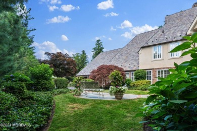 This stunning 5-bedroom, 5.5-bathroom English Tudor waterfront on Navesink Country Club in New Jersey - for sale on GolfHomes.com, golf home, golf lot