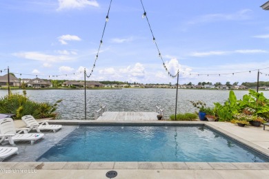 Welcome to 121 Camden Lane - a dreamy waterfront retreat!  This on Lake Caroline Golf Club in Mississippi - for sale on GolfHomes.com, golf home, golf lot