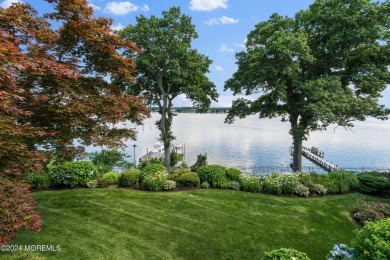 This stunning 5-bedroom, 5.5-bathroom English Tudor waterfront on Navesink Country Club in New Jersey - for sale on GolfHomes.com, golf home, golf lot