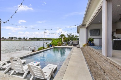 Welcome to 121 Camden Lane - a dreamy waterfront retreat!  This on Lake Caroline Golf Club in Mississippi - for sale on GolfHomes.com, golf home, golf lot