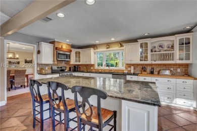 Nestled in Palmetto Dunes, this stunning 5-bedroom, 4.5-bath on Palmetto Dunes Golf Course and Resort in South Carolina - for sale on GolfHomes.com, golf home, golf lot