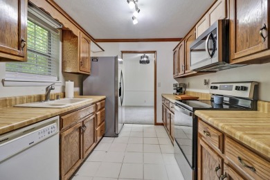 Enjoy lake views of St. George from this beautifully updated 1 on Druid Hills Golf Club in Tennessee - for sale on GolfHomes.com, golf home, golf lot