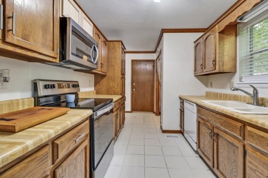Enjoy lake views of St. George from this beautifully updated 1 on Druid Hills Golf Club in Tennessee - for sale on GolfHomes.com, golf home, golf lot
