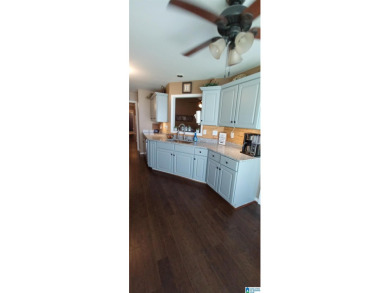 The seller has just upgraded to beautiful LVP flooring on Magnolia Meadows Golf Course in Alabama - for sale on GolfHomes.com, golf home, golf lot